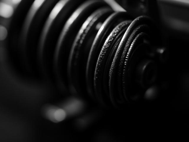 A highly detailed macro shot of a vintage camera's focal plane shutter, revealing the intricate mechanics.
